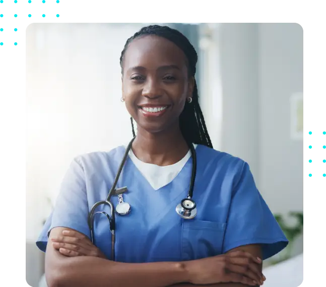 A woman in scrubs with her arms crossed.